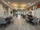 A community center's lounge with seating arrangements and decorative lighting fixtures at 1463 Riverboat Dr, Kissimmee, FL 34744