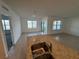Bright, open living area with tile flooring, a granite kitchen island, and sliding doors at 1463 Riverboat Dr, Kissimmee, FL 34744