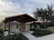 Community mailboxes are sheltered by a dark roof and surrounded by landscaping at 1463 Riverboat Dr, Kissimmee, FL 34744