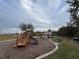 Community playground with various play structures and seating areas, designed for Gathering fun at 1463 Riverboat Dr, Kissimmee, FL 34744