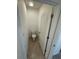 Compact toilet room featuring neutral tile flooring and white fixtures at 1463 Riverboat Dr, Kissimmee, FL 34744