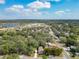 Aerial view of the community showcasing surrounding houses and a lake at 1510 Oak Ln, Casselberry, FL 32707
