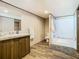 Bathroom with wood-look flooring, vanity with sink, and shower at 1510 Oak Ln, Casselberry, FL 32707