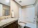 Bathroom featuring a vanity with granite countertop and a shower-tub combo at 1510 Oak Ln, Casselberry, FL 32707