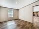 A bedroom with durable flooring, neutral wall colors, and lots of sunlight at 1510 Oak Ln, Casselberry, FL 32707