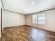 Empty bedroom with wood-look floors, two windows, and neutral walls at 1510 Oak Ln, Casselberry, FL 32707