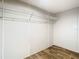 A closet featuring white walls, wood flooring, and wire shelving for storage at 1510 Oak Ln, Casselberry, FL 32707
