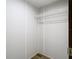A simple closet with white walls, wire shelving, and durable plank flooring at 1510 Oak Ln, Casselberry, FL 32707