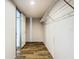 A well-lit closet with wood floors, white walls, and wire shelving at 1510 Oak Ln, Casselberry, FL 32707