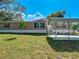 Charming single-story home showcasing a carport, landscaped front yard, and light beige vinyl siding at 1510 Oak Ln, Casselberry, FL 32707