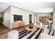 Living room with a neutral color scheme, modern furniture, and stylish decor at 1510 Oak Ln, Casselberry, FL 32707