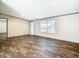 Inviting living room featuring wood-look flooring, neutral walls, recessed lighting, and large windows at 1510 Oak Ln, Casselberry, FL 32707