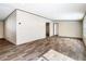 Spacious living room with wood-look flooring, neutral walls, and recessed lighting at 1510 Oak Ln, Casselberry, FL 32707