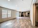 Open-concept living area with a view into the kitchen and natural light at 1510 Oak Ln, Casselberry, FL 32707