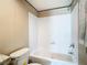 Bathroom featuring a shower-tub combo with a white surround at 1510 Oak Ln, Casselberry, FL 32707