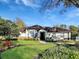 Charming single-story home with well-manicured lawn, beautiful landscaping, and inviting walkway at 1527 Dingens, Windermere, FL 34786