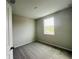 A bedroom featuring neutral walls, carpet, a window, and white trim at 15352 Burgtheater Dr, Winter Garden, FL 34787