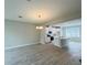 Bright, open-concept dining area with a chandelier, flows into a modern kitchen with an island at 15352 Burgtheater Dr, Winter Garden, FL 34787
