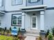 Close-up of a townhome entrance showing stylish details and landscaping, enhancing curb appeal at 15352 Burgtheater Dr, Winter Garden, FL 34787