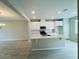 Bright kitchen with a center island, white cabinetry, and an adjacent dining area, perfect for gatherings at 15352 Burgtheater Dr, Winter Garden, FL 34787