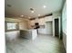 Spacious kitchen featuring white cabinets, stainless steel appliances, and a large center island at 15352 Burgtheater Dr, Winter Garden, FL 34787