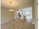 Bright, open-concept kitchen with white cabinets, a large island, and modern appliances at 15352 Burgtheater Dr, Winter Garden, FL 34787