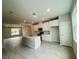Bright kitchen featuring stainless appliances, island with sink, and tile flooring at 15352 Burgtheater Dr, Winter Garden, FL 34787