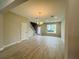Bright living room featuring tile floors, chandelier, and staircase at 15352 Burgtheater Dr, Winter Garden, FL 34787