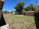Spacious backyard with lush green grass, shed, and ample room for outdoor activities at 1703 Doreen Ave, Ocoee, FL 34761