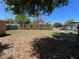 Spacious backyard with plenty of room for outdoor activities, featuring a partial fence at 1703 Doreen Ave, Ocoee, FL 34761