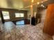 Bright living area showcasing hardwood floors and natural light flowing into the kitchen and dining space at 1703 Doreen Ave, Ocoee, FL 34761