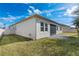 A well-maintained backyard features a screened lanai, providing a relaxing outdoor living space at 1711 Lake Sims Pkwy, Ocoee, FL 34761