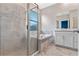 Modern bathroom featuring tiled shower, soaking tub, and vanity with marble countertops at 1711 Lake Sims Pkwy, Ocoee, FL 34761