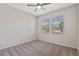 Neutral bedroom with carpet, ceiling fan, and natural lighting at 1711 Lake Sims Pkwy, Ocoee, FL 34761