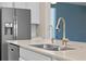 Stylish kitchen with stainless steel appliances, granite countertops, and a double sink at 1711 Lake Sims Pkwy, Ocoee, FL 34761