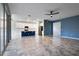 Open-concept living room with tile flooring and views of the kitchen and dining area at 1711 Lake Sims Pkwy, Ocoee, FL 34761