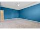 Large primary bedroom featuring a ceiling fan and neutral carpet at 1711 Lake Sims Pkwy, Ocoee, FL 34761
