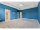 Primary bedroom featuring an ensuite bathroom and a walk-in closet at 1711 Lake Sims Pkwy, Ocoee, FL 34761
