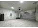 Spacious garage with concrete floors and a modern, automatic garage door at 17325 Sw 41St Cir, Ocala, FL 34473