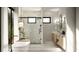 Modern bathroom with soaking tub, a glass-enclosed shower, and elegant vanity with decorative sconces at 2102 S Osceola Ave, Orlando, FL 32806