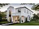 Modern two-story home exterior with clean lines, a covered entry, and manicured landscaping at 2102 S Osceola Ave, Orlando, FL 32806