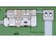 Open floor plan featuring the kitchen, dining room, living room, and guest bedroom connected to a two-car garage at 2102 S Osceola Ave, Orlando, FL 32806