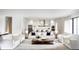 Bright, open-concept living room featuring modern furnishings, a kitchen view, and an inviting atmosphere at 2102 S Osceola Ave, Orlando, FL 32806