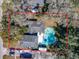 Aerial view of property with a backyard pool, surrounded by trees, RV parking, and outlined in red at 215 Nob Hill Cir, Longwood, FL 32779