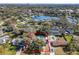 Aerial view of the property with a private pool, surrounded by lush trees, clearly outlined in red at 215 Nob Hill Cir, Longwood, FL 32779