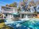 Enjoy the private backyard oasis with a pool, patio, and a grill, perfect for outdoor dining at 215 Nob Hill Cir, Longwood, FL 32779