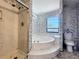 Bathroom view with shower, tub, toilet and window at 215 Nob Hill Cir, Longwood, FL 32779