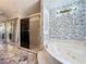 Bathroom view with tub, shower, sinks and mirrors at 215 Nob Hill Cir, Longwood, FL 32779