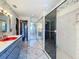 Bathroom view with sinks, shower, and mirrors at 215 Nob Hill Cir, Longwood, FL 32779