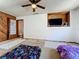 Bedroom with wood paneled wall and custom tv nook at 215 Nob Hill Cir, Longwood, FL 32779
